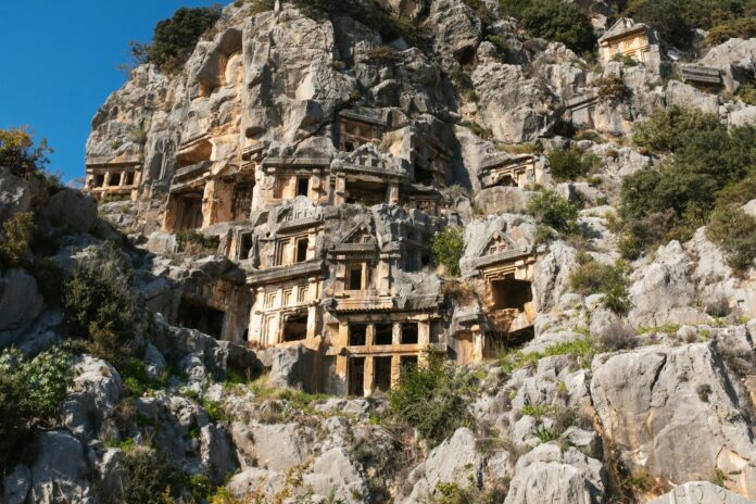 a mountain with a bunch of buildings built into the side of it