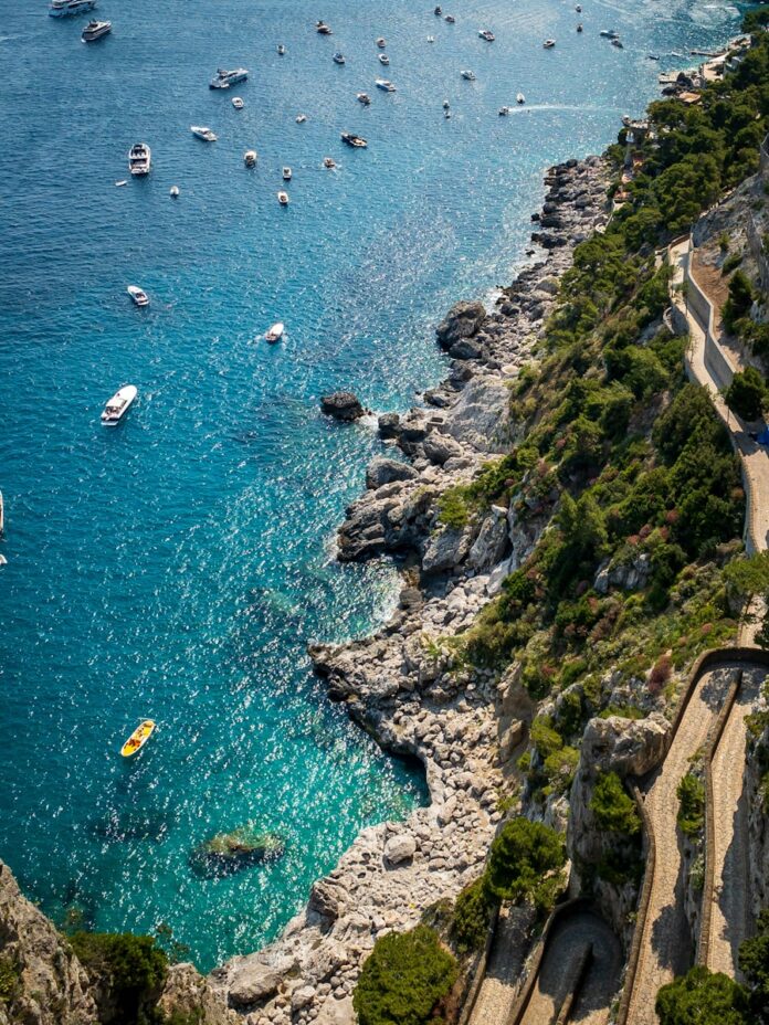 a view of a beach with boats in the water