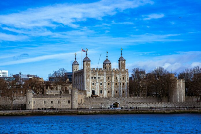 a large castle sitting next to a body of water