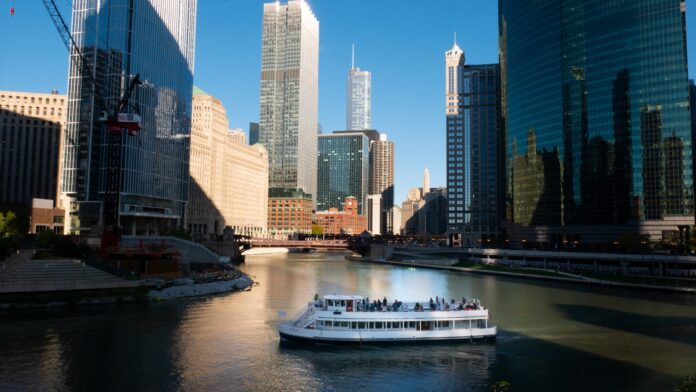 white cruise ship on water near city buildings during daytime