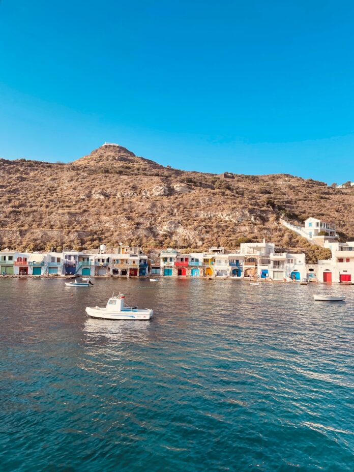 a group of boats floating on top of a body of water