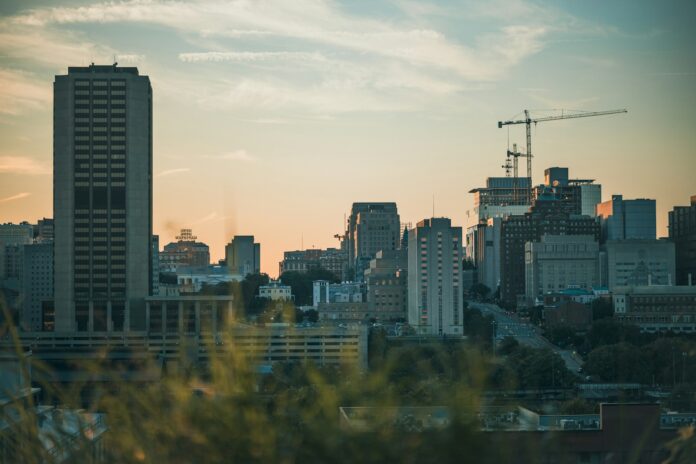 a view of a city skyline with a crane in the background