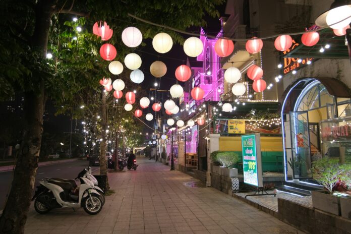 a city street with a motorcycle parked on the side of it