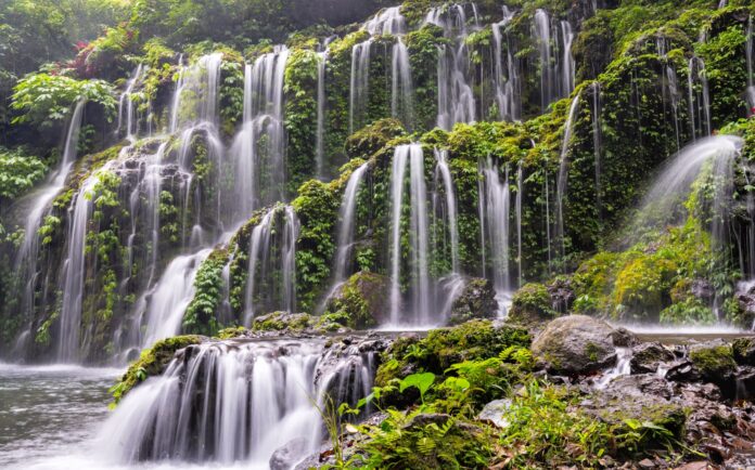 a large waterfall with lots of water cascading down it