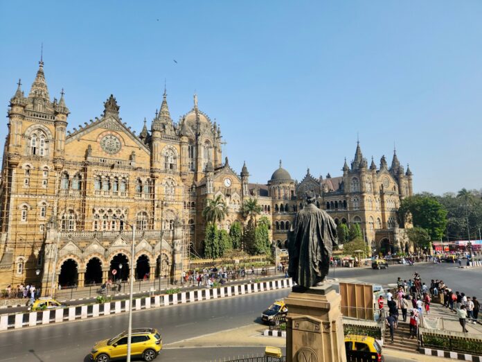 a large building with a statue in front of it