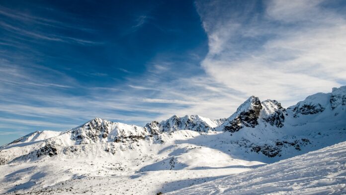 snow covered mountain under blue sky during daytime