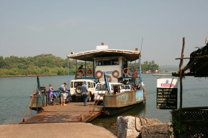 A group of people standing on a dock next to a boat