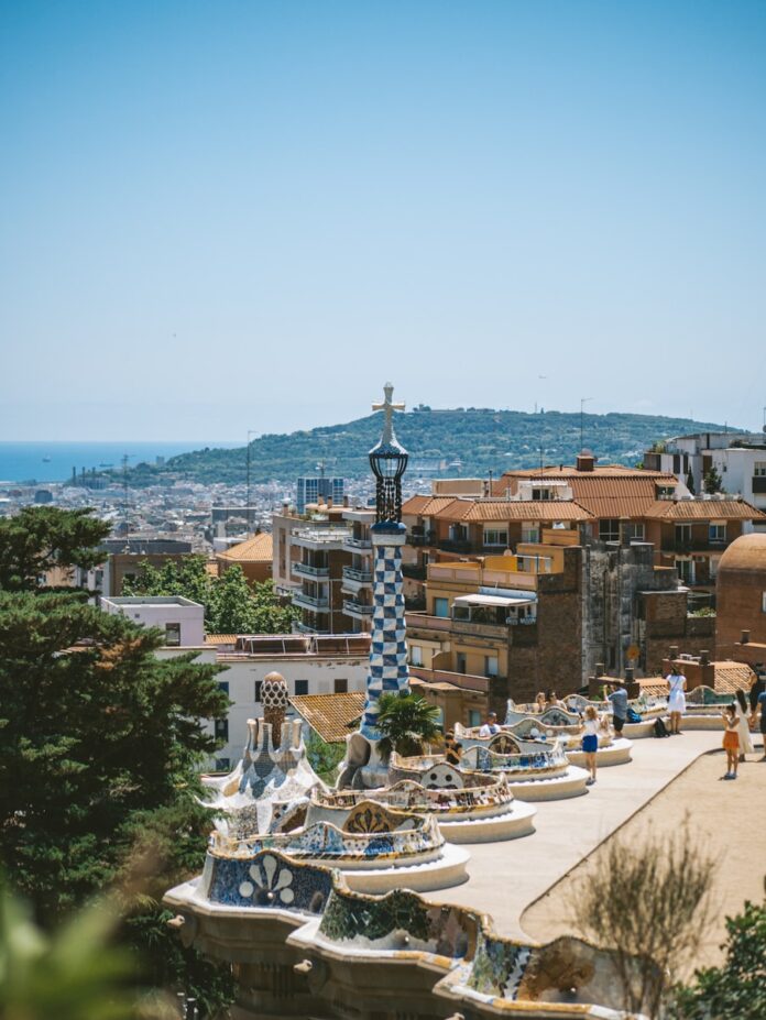 a city with a fountain and boats