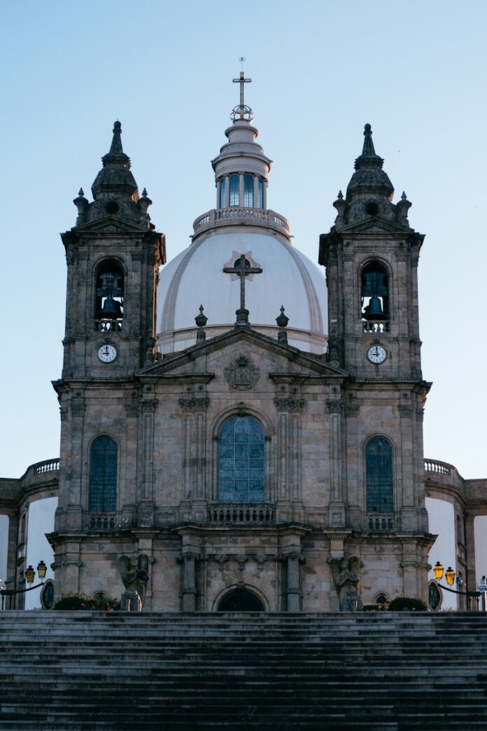 a church with a steeple and a clock tower